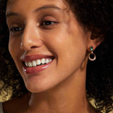 A model wears a chic moss agate earrings sterling silver in gold