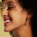 A model wears a chic moss agate earrings sterling silver