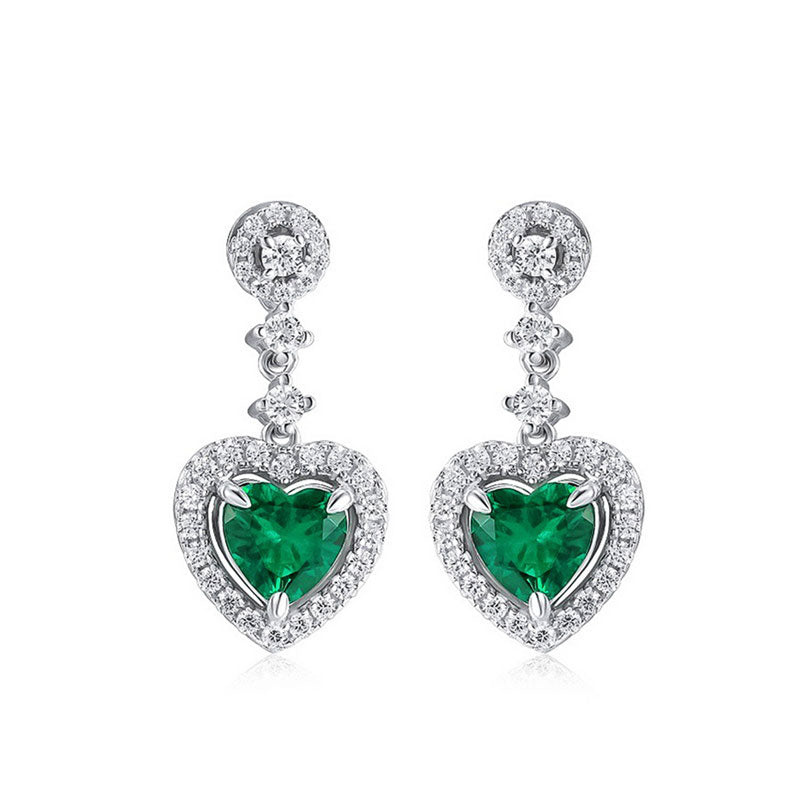 Drop earrings featuring lab-grown emeralds in silver