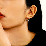 Women Wearing A Twisted Sterling Silver Earrings Huggies